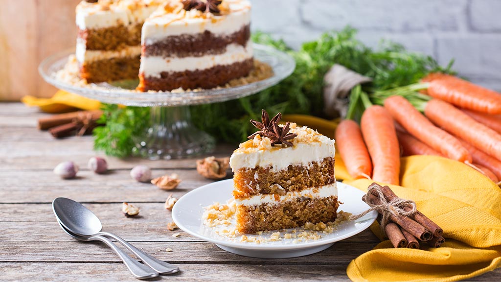 Carrot cake layered with buttercream – gluten-free, low FODMAP and vegan recipe.
