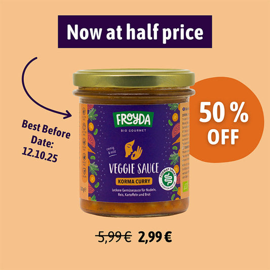 Jar of Froyda Veggie Sauce Korma Curry with promotional text on a beige background